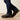 Ariat FR M7 Slim DuraStretch Straight Leg Jean in Shale — straight leg hem over work boots. Detail view.