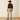 Ariat M4 Relaxed Grizzly Boot Cut Jean in Cedar Brown — relaxed seat and thigh. Back view on model.