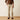 Ariat M4 Relaxed Grizzly Boot Cut Jean in Cedar Brown — relaxed fit, boot cut leg. Front view on model.