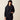 Ariat Compass 1/2 Zip Sweatshirt in Black — half-zip, drawcord hood, yoke seam. Front view on model.