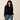 Ariat Butler Pullover in Black — wrapped collar, two-button placket. Front view on model.