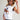 Eesome Western Inspired knit top in Off White — cap sleeve and ribbed hem detail. Side on-model.
