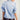 Eesome polka dot satin blouse in Powder Blue — puff sleeves with button cuffs, relaxed body. Back on-model.