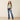 Ariat Lilla Boot Cut Jean in Ashland — boot cut leg over boots. Full-length view on model.