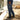 Circle A Western and Work Ariat men's relaxed fit boot cut jeans in medium wash denim with orange pocket tools.