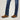 Circle A Western and Work Ariat men's dark wash denim jeans with white stitching and brown suede boots.