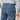 Circle A Western and Work Ariat men's relaxed fit boot cut jeans in medium wash denim with orange stitching and FR logo patch.
