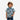 Circle A Western and Work baby boy wearing a light blue short sleeve pearl snap shirt with cowboy print at a playground