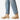 Circle A Western and Work beige suede Chelsea boots with elastic side panels and thick lug soles, worn with light wash jeans.