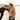 Circle A Western and Work camel knit sweater featuring western ranch scenes, horses, and cacti worn by a woman