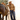 Circle A Western and Work camel knit sweater featuring western ranch scenes, worn by a woman with a cowboy hat and horse