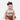 Circle A Western and Work baby wearing a long sleeve onesie with a cowgirl graphic and a large brown hair bow