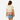 Back view of a girl wearing a Circle A Western and Work pink colorblock tiered tee with ruffled sleeves and a skirt.