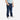 Toddler boy wearing Circle A Western and Work Wrangler dark wash denim jeans with a light blue tee and white sneakers