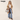 Circle A Western and Work Wrangler cow-print faux leather laptop brief bag carried by a woman in western attire