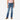 A young girl wearing Circle A Western and Work Wrangler boot cut jeans with a pink t-shirt and brown western boots.