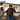Man wearing a Circle A Western and Work brown wool-blend varsity jacket with western piped yokes and a cowboy hat